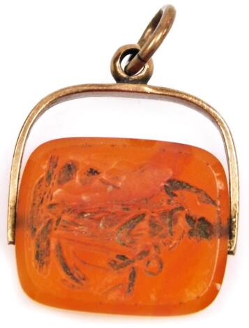 A 19thC carnelian panel wax seal, with a ring handle, set with a figure of a lady beneath, yellow metal, 2.5cm high.