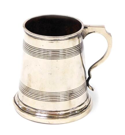 An early 19thC Electroplate pint tankard, stamped to underside Harris, with VR6 and 2 stamp, on a ribbed body, 12cm high.