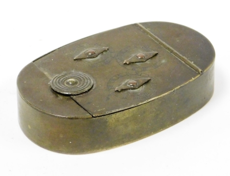 An early 19thC novelty brass snuff box, oval with coded entry, set with three Roman numeric clocks with articulated diamond shaped pointers and plain interior, of oval form, indistinctly initialed probably GA, 1830, 8cm wide.