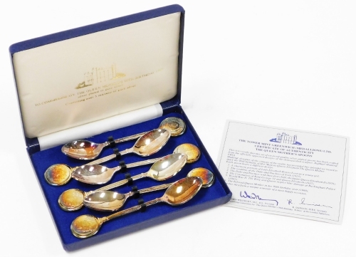 A cased set of six The Queen Mothers 90th birthday commemorative teaspoons, with circular tops shaped stems and plain bowls, silver plated on pure silver, contained 5 microns of pure silver, the case 15cm wide.