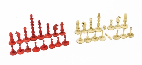 A late 19th/early 20thC miniature bone chess set, each king approximately 5cm high, red and white colours. (AF - white queen missing)