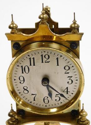 A brass anniversary clock, with two wind movement in a plastic dome, 31cm high. - 2