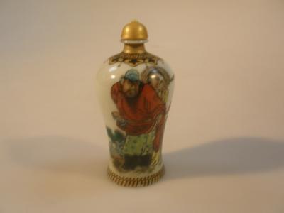 A Republican period Chinese scent bottle and stopper decorated with male