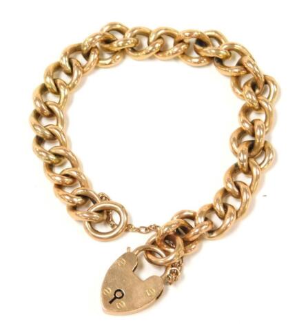 A 9ct gold curb link bracelet, the padlock hallmarked 9ct gold with safety chain, 15.7g.