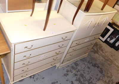 A group of French style white finish bedroom furniture, to include a five drawer chest, and a cupboard and four drawer side unit, the chest of drawers 85cm high, 78cm wide, 48cm deep, the cabinet 102cm high, 78cm wide, 48cm deep. (2)