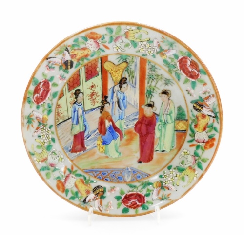 A 19thC Chinese famille rose plate, painted with flowers, figures and butterflies, on a celadon ground, underglaze blue mark to the underside, 19cm diameter.