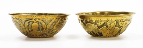 Two Eastern brass finger bowls, each repousse decorated and hammered with animals and flowers, 13cm wide. (2)