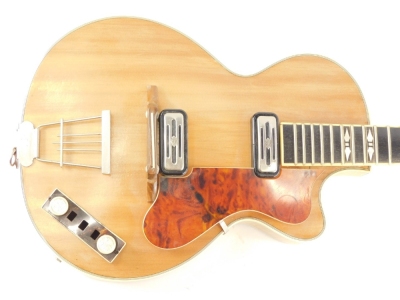 A Hofner electric guitar, with plated mounts, the ebonised finger board inlaid with mother of pearl two piece maple back, with simulated ivory borders, 97cm long. - 2