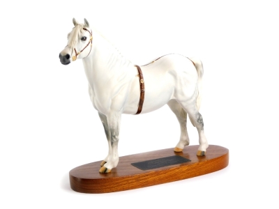 A Beswick Connnoisseur matt glazed model of Champion the Welsh Mountain pony, number 3614, on a hardwood base, 25cm long.