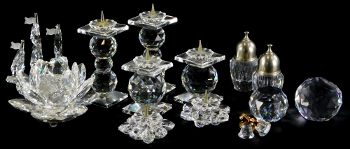 A collection of Swarovski Crystal, etc., to include various candlesticks, a ship, a pair of bells, two small paperweights, etc.