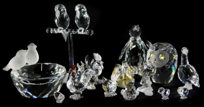 A collection of Swarovski Crystal birds, to include a penguin, two parrots on a perch, an owl, goose, cockerel, etc.