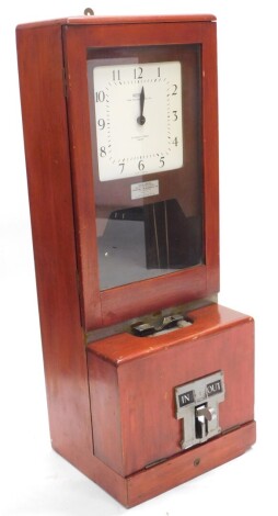 A National Time Recorder Company Limited clocking in clock, the painted dial stamped St Mary Cray, Kent, in a stained hardwood case, 94cm high, 36cm wide.