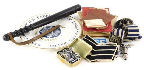 A collection of Police memorabilia etc., to include pocket books, a Diamond Jubilee commemorative plate, badges, a whistle, a hardwood truncheon indistinctly numbered, etc.