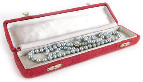 A blue blister pearl necklace, the similar sized pearls approx 8mm wide, on knotted white string, with a 9ct white gold clasp, marked 9kt, the clasp in a cluster with central blister pearl, surrounded by seed pearls, 65cm long overall.