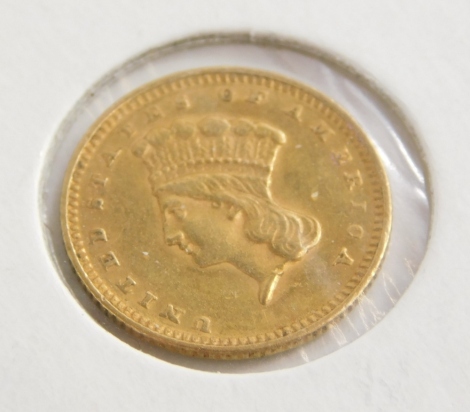 An 1874 gold USA one dollar coin, in presentation cardboard sleeve.