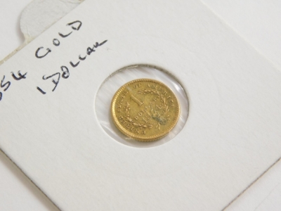 An 1854 gold USA one dollar, in presentation sleeve. - 2