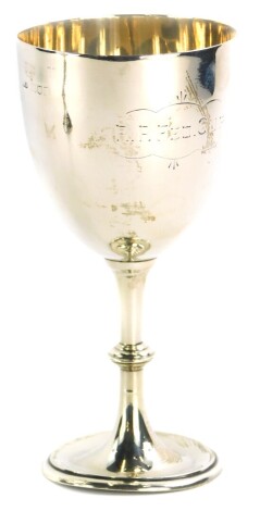 An Edwardian silver trophy, of plain form with a dome foot, engraved R.P.Fed. Cup, London 1907, 3oz, 16cm high.