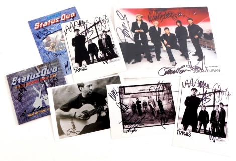 A collection of pop memorabilia, to include a signed Status Quo CD and small poster, and various photographs bearing signatures of the band Duran Duran, Travis, Eric Clapton, etc.