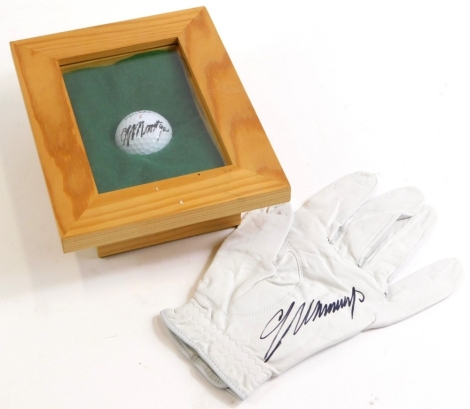 A golf glove signed by Colin Montgomerie, and a framed Callaway golf ball, the ball bearing signature.