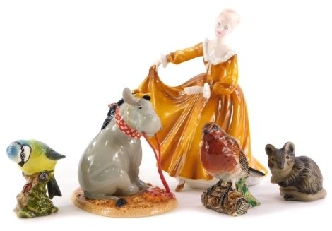 A collection of ceramic figures, to include a Royal Doulton Eeyore figure, Royal Doulton Lady Kitty, two Beswick birds and a Poole Pottery mouse. (5)