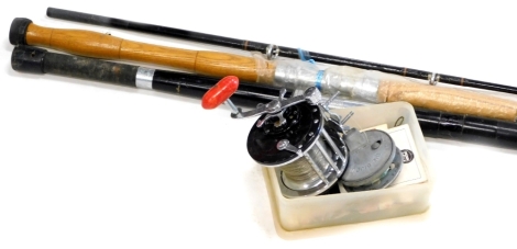 A Penn Longbeach 66 fishing reel, a bijou fly fishing reel, two rods and some fishing accessories.