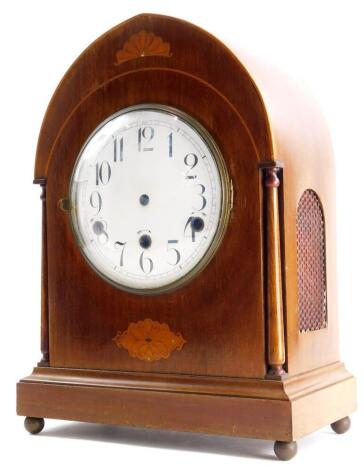 A late 19thC/early 20thC mahogany and marquetry clock case, the white enamel dial with Roman numerals, lacking movement, 39cm high.