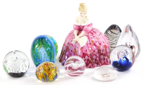 A collection of art glass paperweights, various styles and makes and a Royal Doulton figurine Victoria.