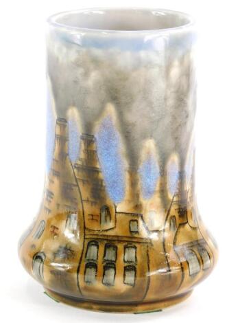 A Cobridge ceramic vase, decorated with kilns, etc., 20cm high.