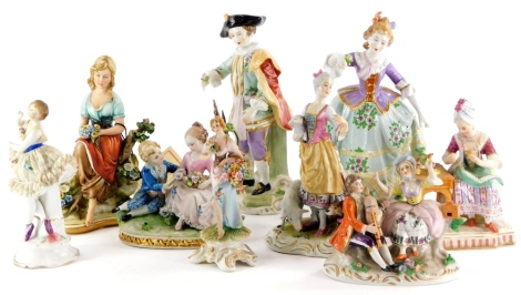 A collection of continental porcelain figurines, to include a figure of a lady beside a table with flowers, impressed stylised beehive mark to underside, a crinoline lady, a pair of German figures, etc.