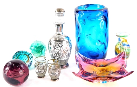 A collection of coloured art glass, to include a Whitefriars style turquoise vase, an apple shaped paperweight, etc.