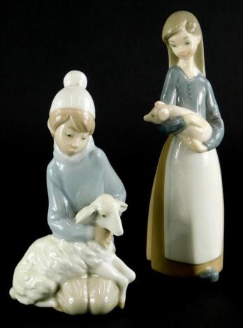 Two similar Lladro porcelain figures, one modelled with a sheep, the other a piglet, 17cm high overall.