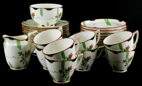 A Mintons Art Deco style part tea service, each piece decorated with flowers, leaves, etc., some pieces. (AF)