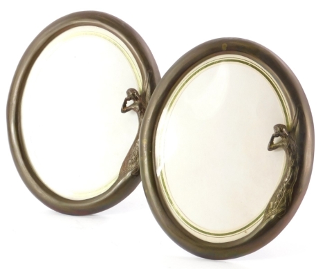 A pair of bronzed metal Art Nouveau style oval photograph frames, each decorated with the female figure, 25cm high.