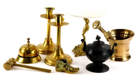 A pair of ecclesiastical brass candlesticks, of plain form, a bronze two handled urn, a pestle and mortar, miniature table with marble top, a bell, etc.