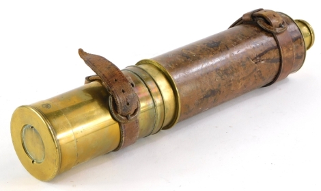 An early 20thC brass and leather four draw telescope, unmarked, 34cm long.