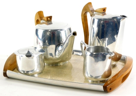 A teak and aluminium Picquot ware four piece tea service, with tray.