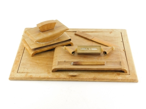 A brown leather desk set, to include blotter, ink stand, with calendar, etc.