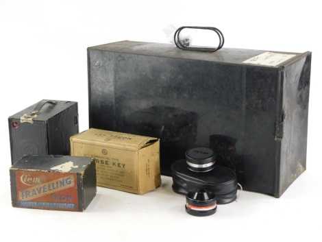 A collection of bygones, to include a Morse Code key, made by Signalling Equipment Limited, a box camera, travelling iron, a pair of Petri Aux lenses, and a blackened tin magic lantern.