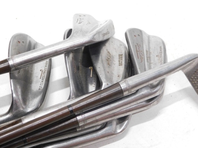 A set of Spalding Henry Cotton golf clubs, each with a metal shaft, a Gutta-Percha golf ball, and a Gibsons Stan Maxwell eight iron with Gibsons Sidera wood shaft. (AF) - 2