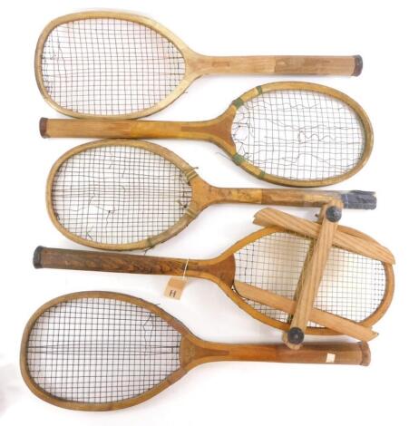 A collection of early 20thC tennis rackets, to include one stamped Club, another Diamond selected, one unmarked, another stamped RGB and Co London The Winner (1) and another stamped Hexagon Patent. (5)