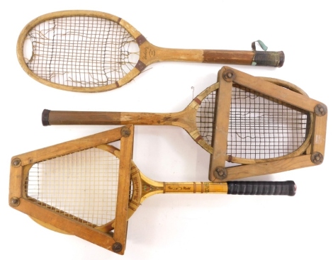 A quantity of vintage tennis rackets, to include examples stamped Spalding Masterbilt, Slazengers Doherty, another stamped Surrey. (3)