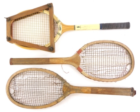 Three vintage tennis rackets, one unmarked, another stamped Slazengers Doherty, another Dunlop Blue Flash. (3)