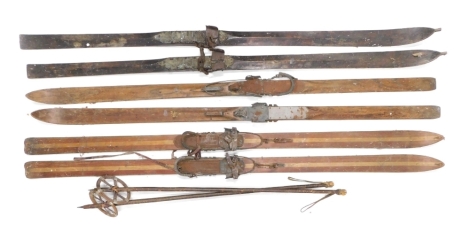 Three pairs of vintage ski's, to include a pair stamped Lampinen Porvoo and a pair of ski poles.