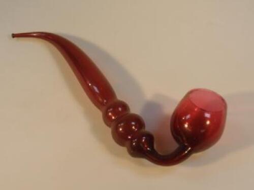 A Victorian cranberry glass novelty pipe