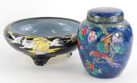 A Keeling Andes pattern ginger jar and cover, printed and painted with flowers, on a deep blue ground, 18cm high, and a Solian ware bowl decorated with a sunset scene with geese etc., 25cm diameter.