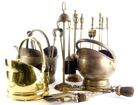 A quantity of metalware, to include three brass coal scuttles, fire tongs, etc.