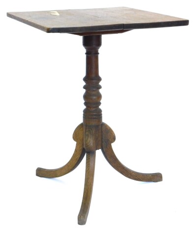 A 19thC oak tilt top occasional table, the rectangular top on a turned column and tripod base, 69cm high, the top 51cm x 53cm.