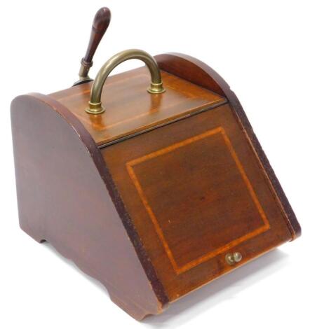 An Edwardian mahogany and satinwood crossbanded coal scuttle, with a brass handle and shovel, 35cm wide.