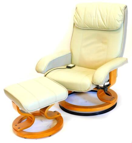 A green leather electric massage armchair, on swivel base, with matching stool.