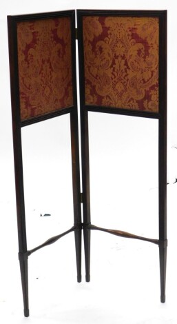 A 19thC rosewood two fold screen, with gold and maroon damask panels, the reeded frames with slender turn supports, 100cm high, 70cm wide.